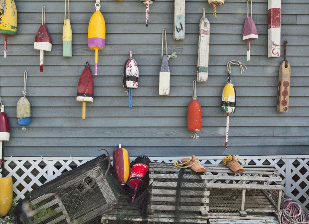 a bunch of umbrellas hanging on the side of a building