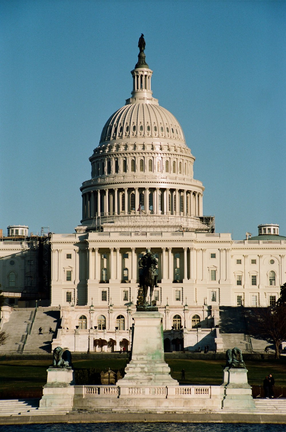 a large building with a statue in front of it