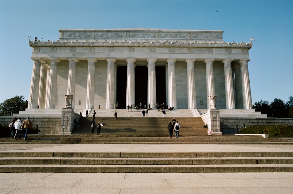 a group of people walking up and down some steps