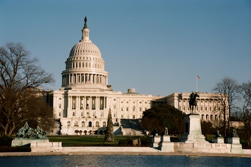the capitol building in washington d c is seen from across the water