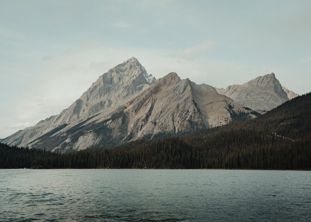 a large body of water with a mountain in the background