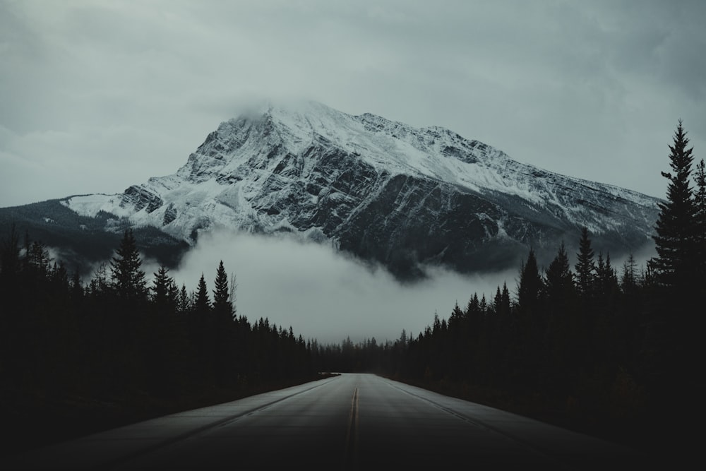 a road with a mountain in the background