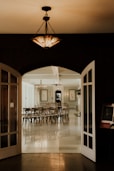 an open door leading into a dining room