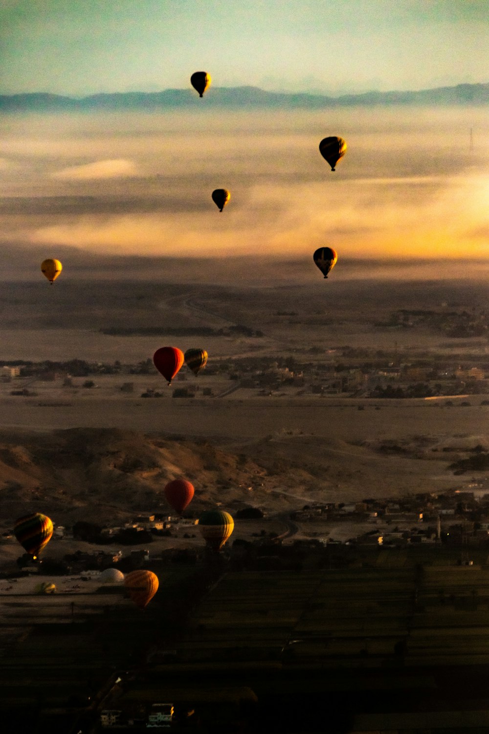 a group of hot air balloons flying in the sky