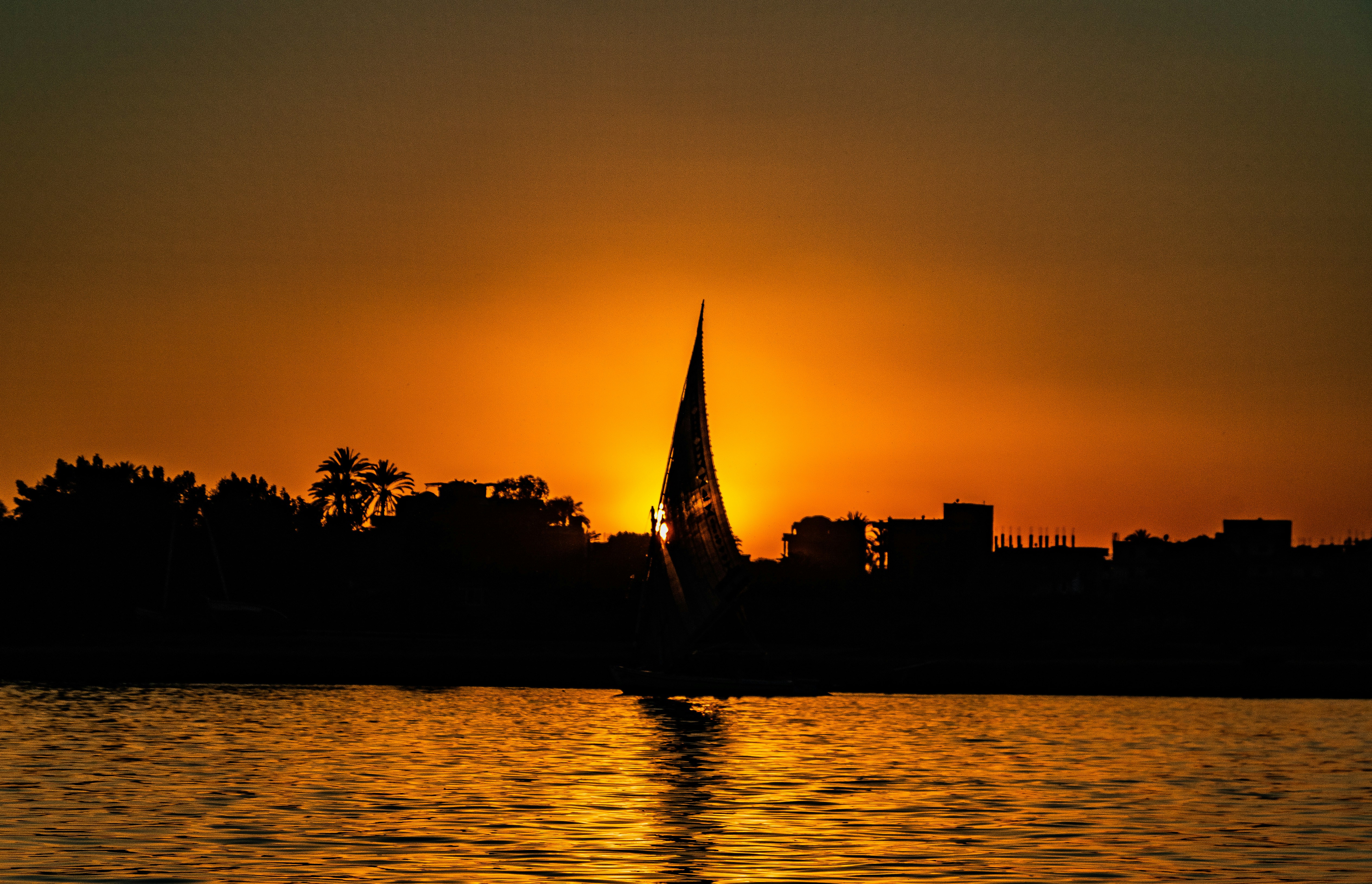 A felucca sailing on the Nile at sunset
