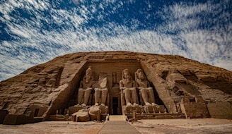 a large building with statues on the side of it