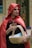 a woman in a red cape holding a basket