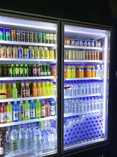 a refrigerator filled with lots of different types of drinks
