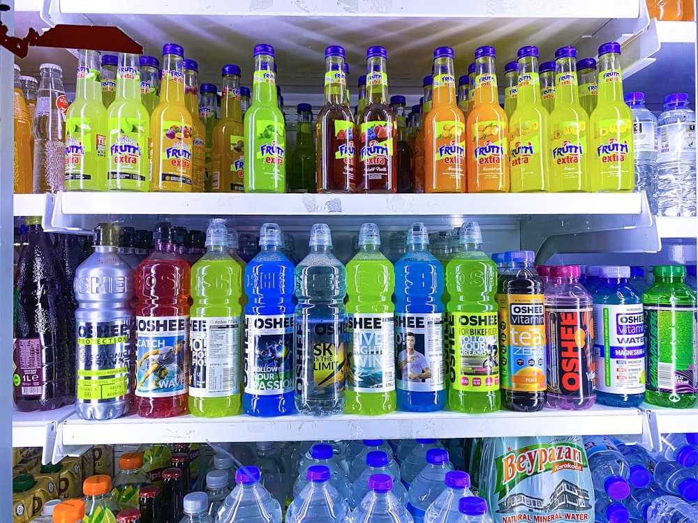 a refrigerator filled with lots of bottles of water