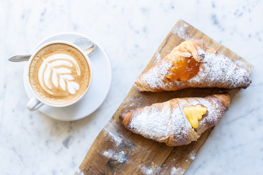 a pastry and a cup of coffee on a table