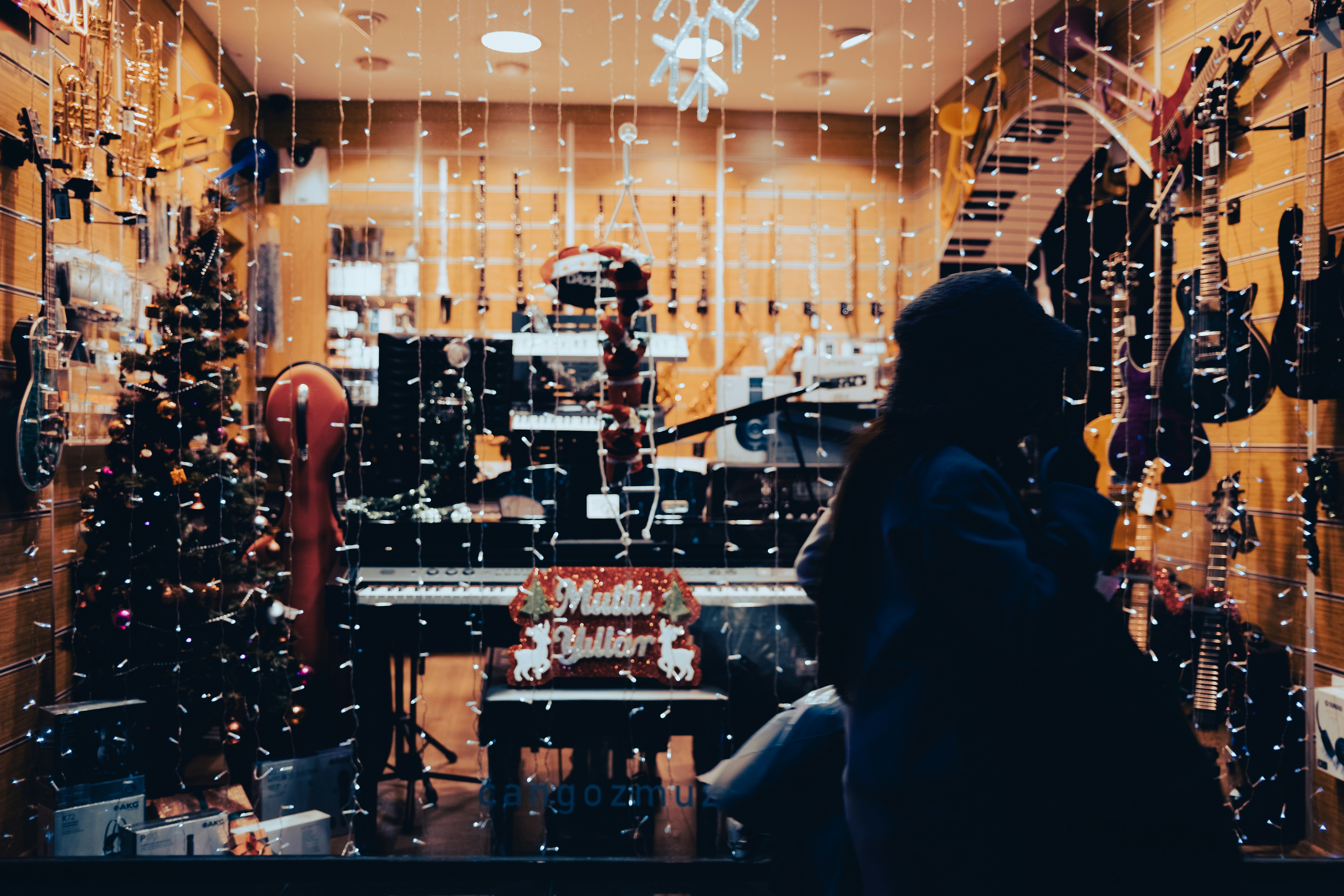 woman in front of music shop