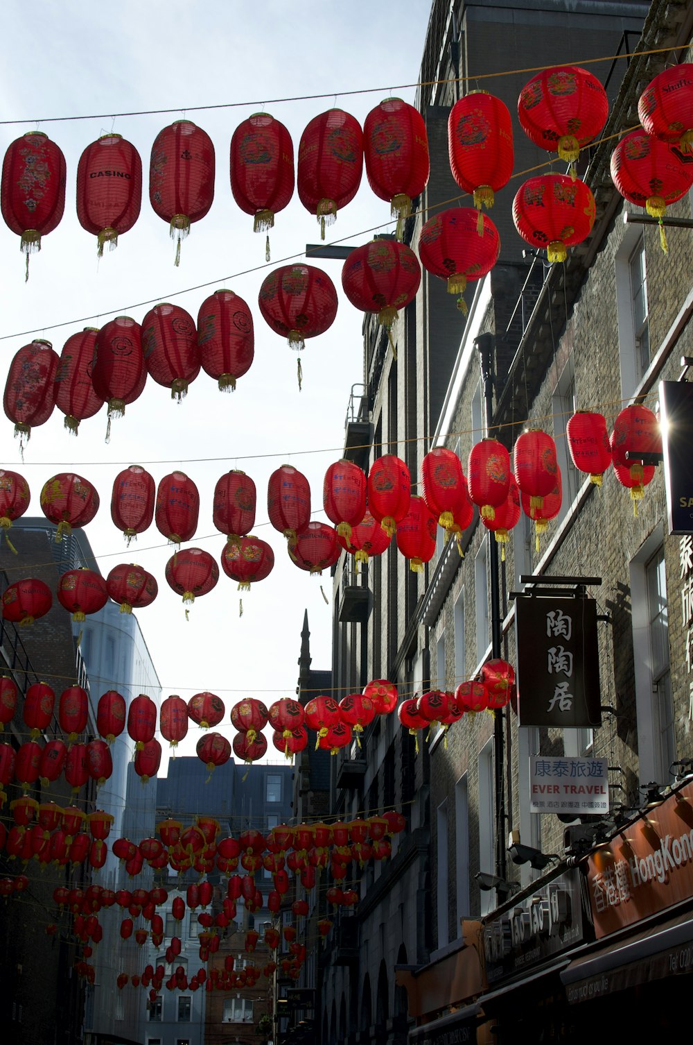 a street filled with lots of red lanterns