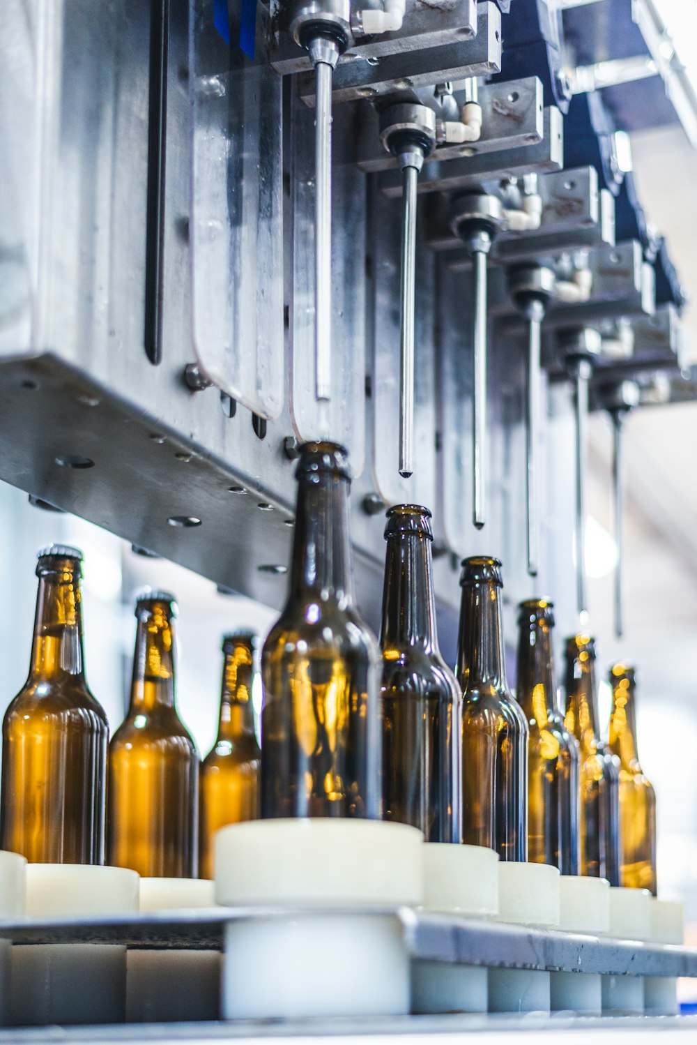 a bunch of beer bottles sitting on top of a table