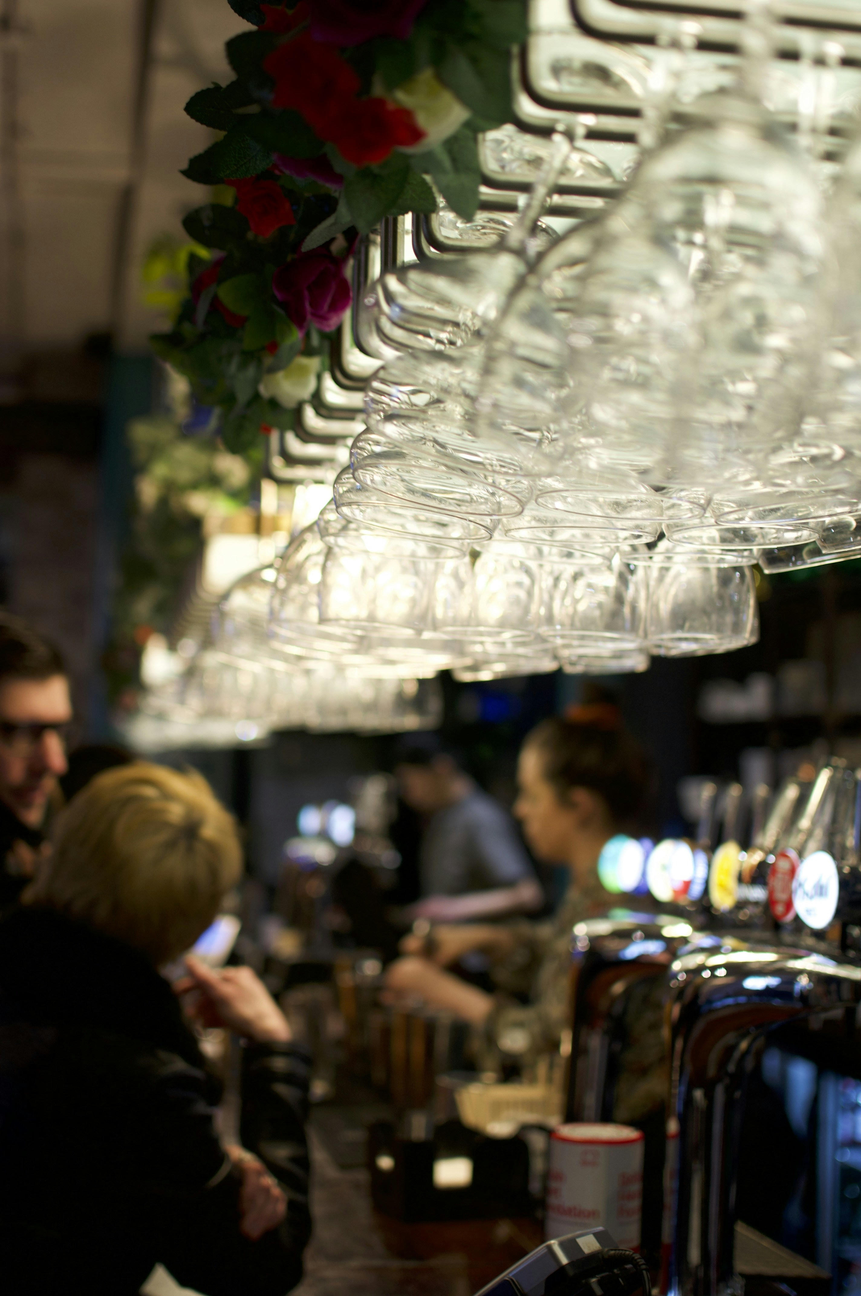A group of people sitting at a bar