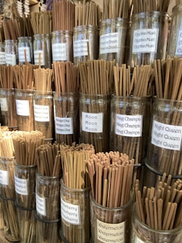 a bunch of cinnamon sticks in a glass jar