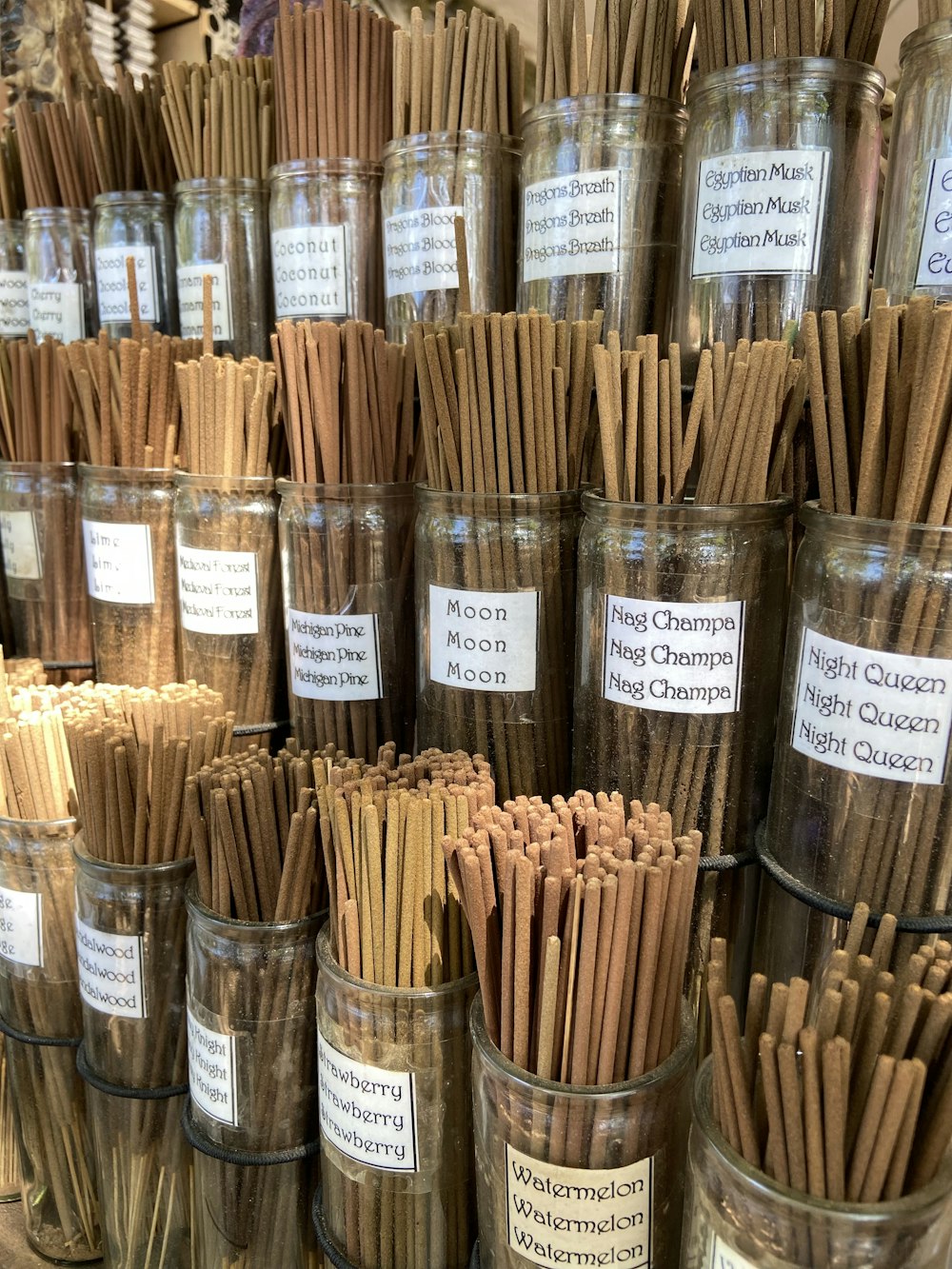 a bunch of cinnamon sticks in a glass jar