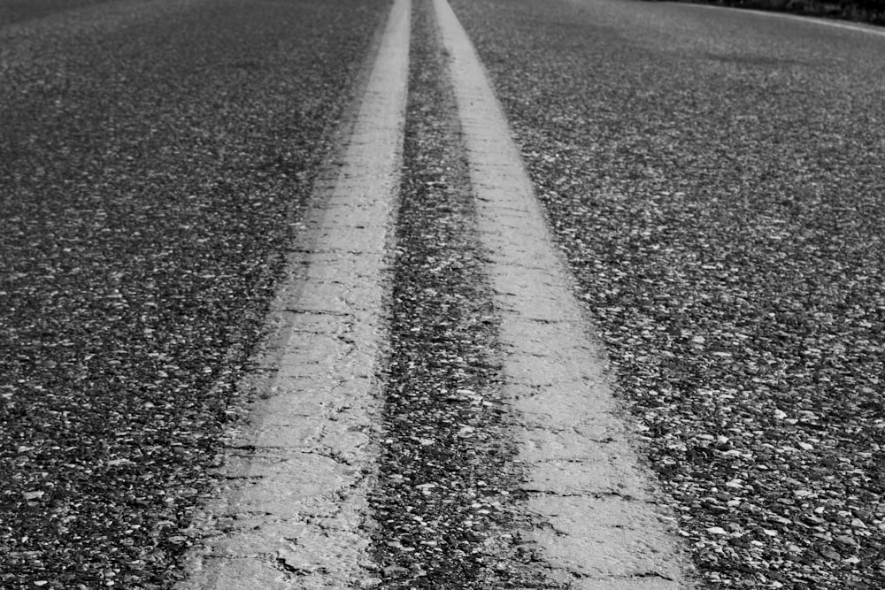 a black and white photo of a road
