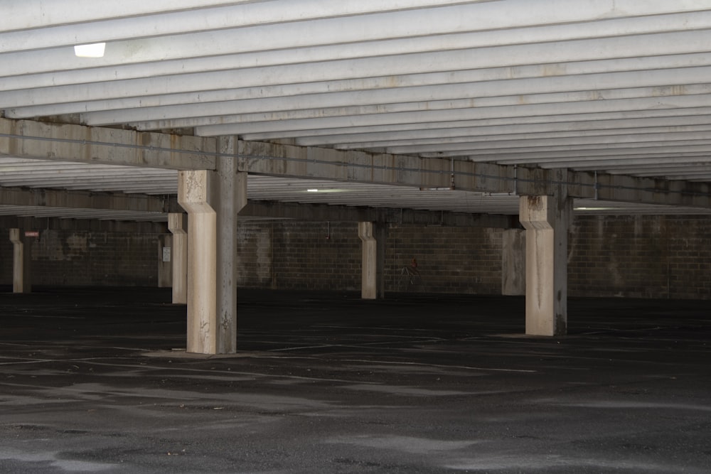 a parking garage filled with lots of parking space