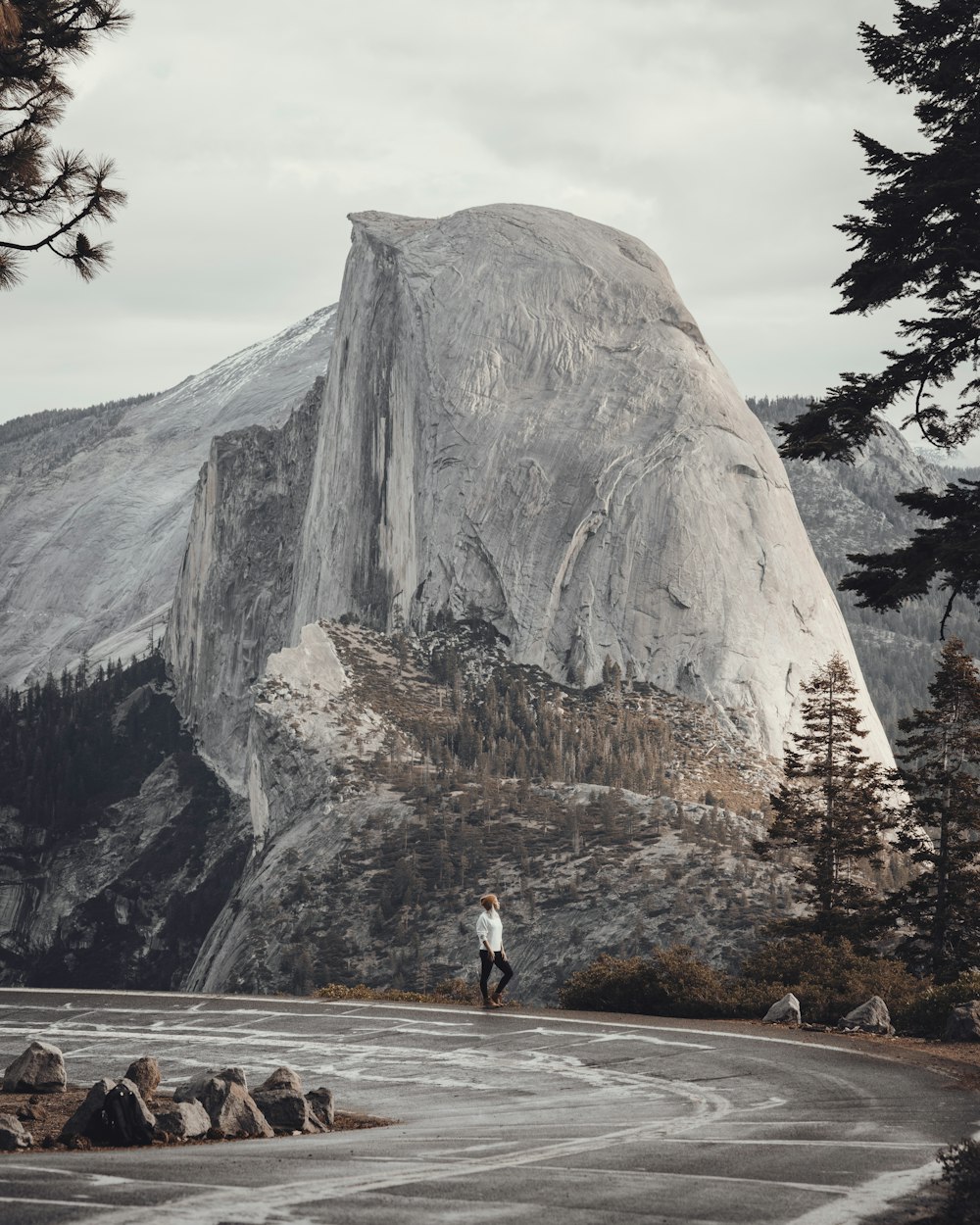 a person standing in front of a mountain