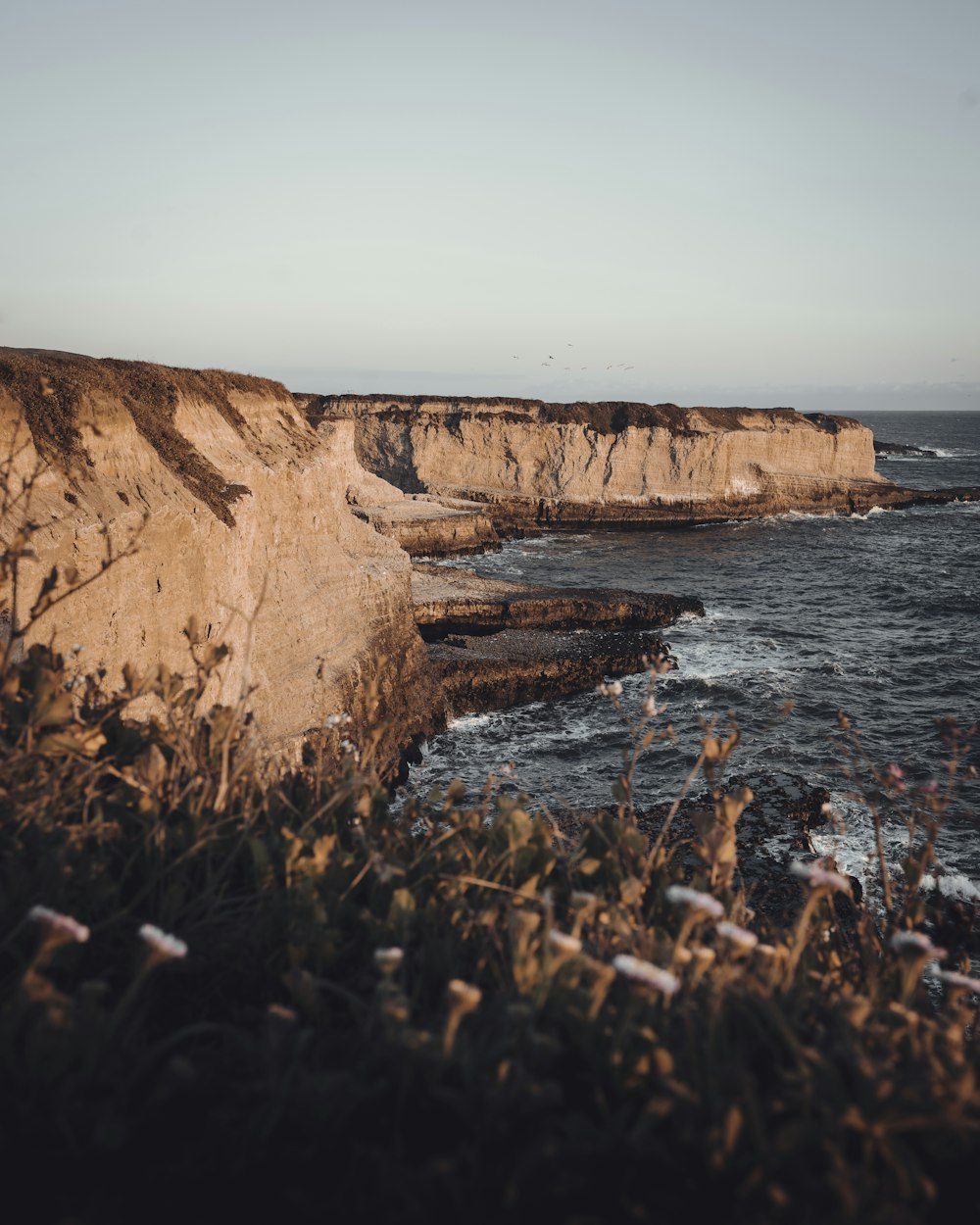 a view of the ocean from a cliff