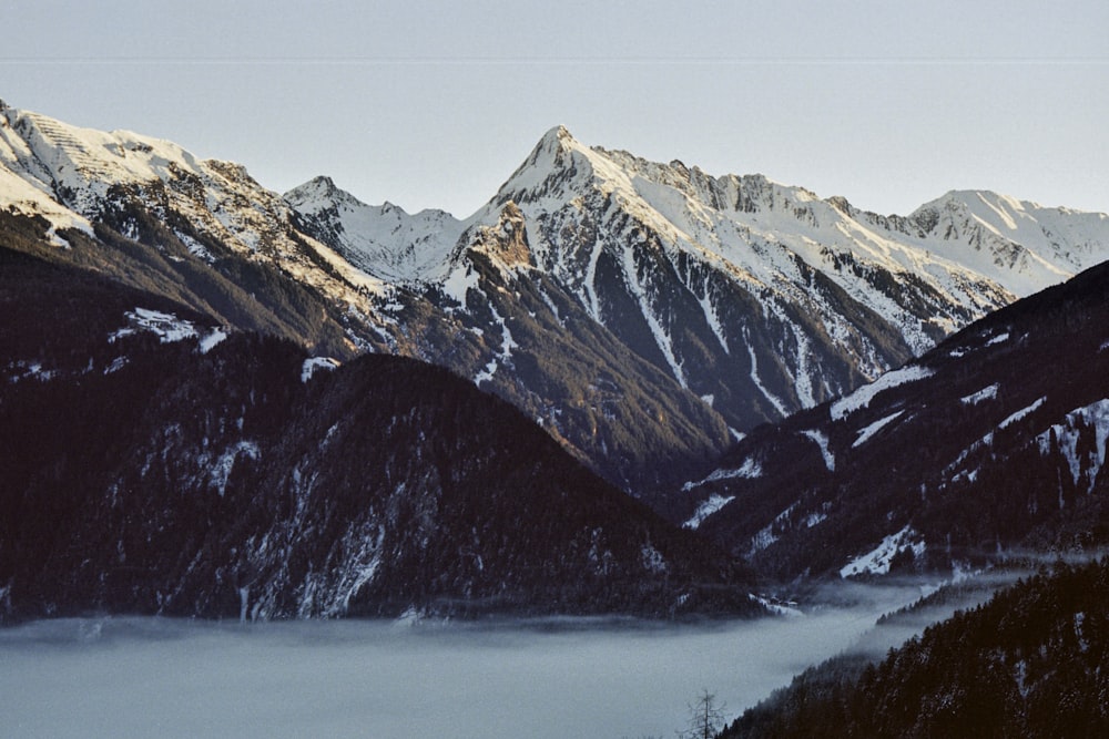 a view of a mountain range covered in snow