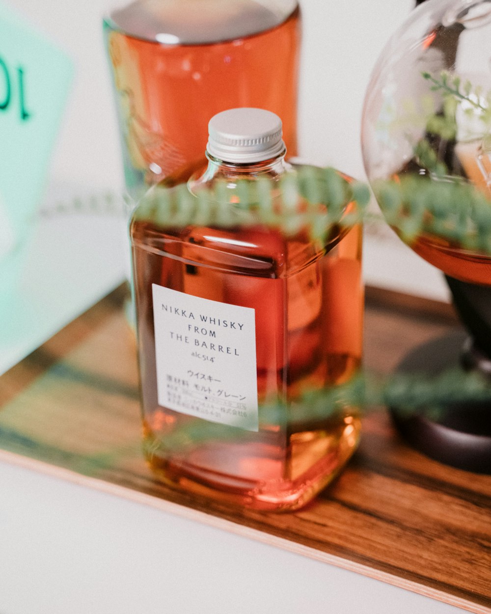 a close up of a bottle of liquid on a table