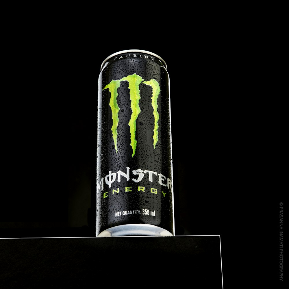 a can of monster energy drink on a table