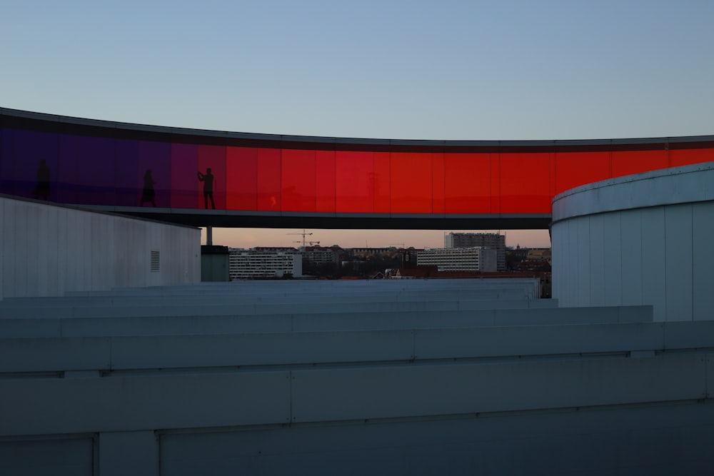 a train is parked on the side of a building