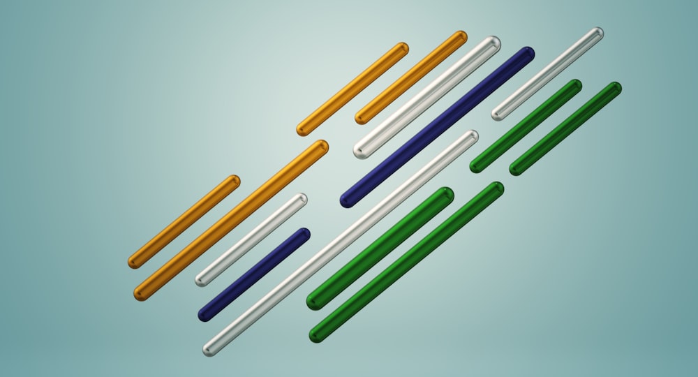 a group of four different colored plastic straws