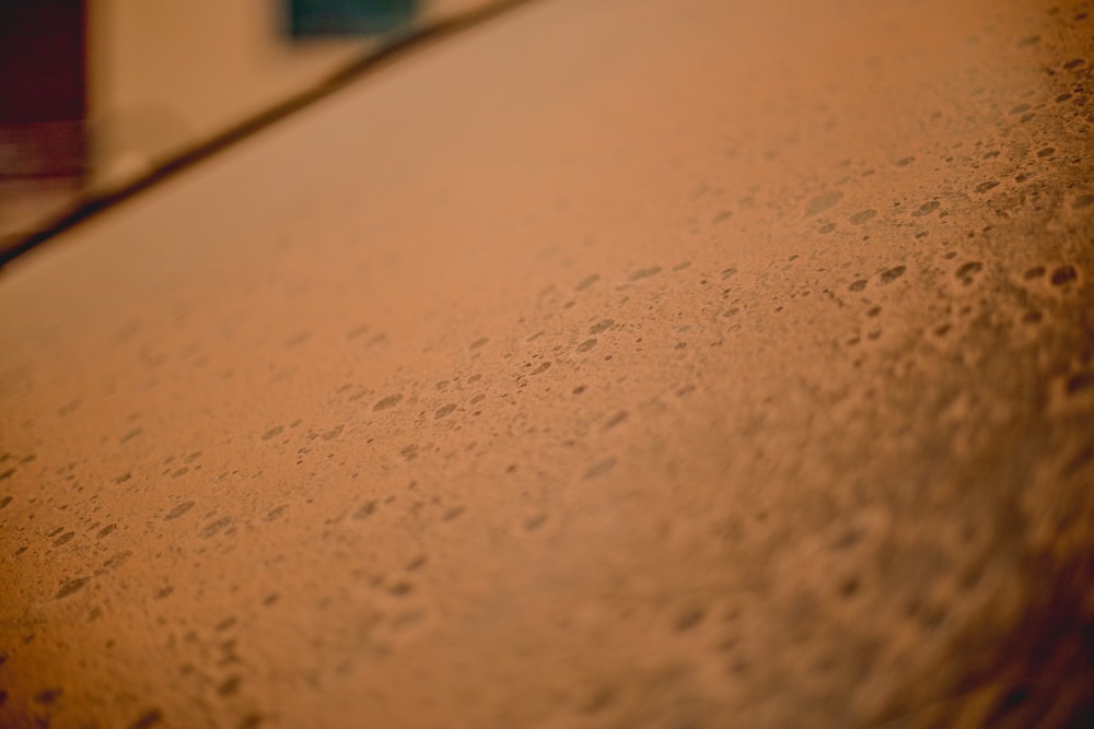 a close up of a surfboard with a blurry background