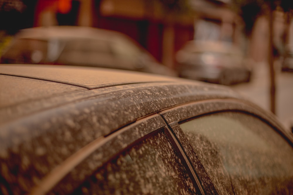 a close up of a car parked on the side of the road