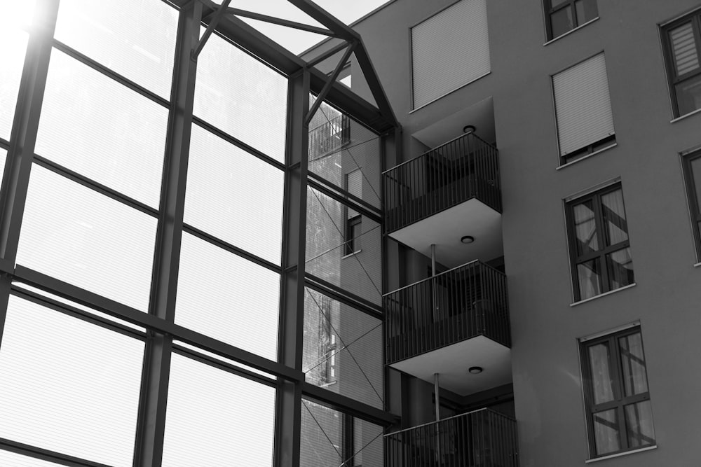 a tall building with lots of windows and balconies