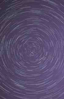 A time-lapse image showing star trails circling the North Star
