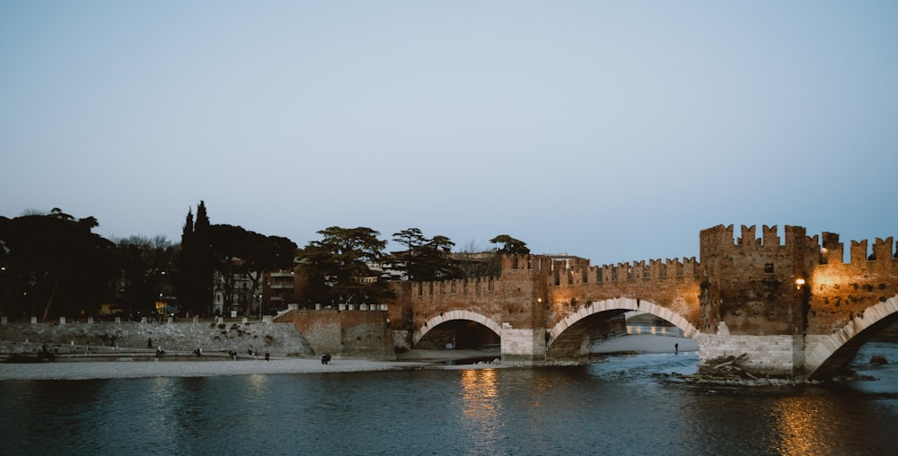 a stone bridge over a body of water