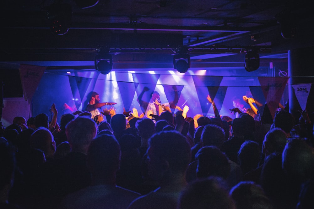 a group of people standing on top of a stage