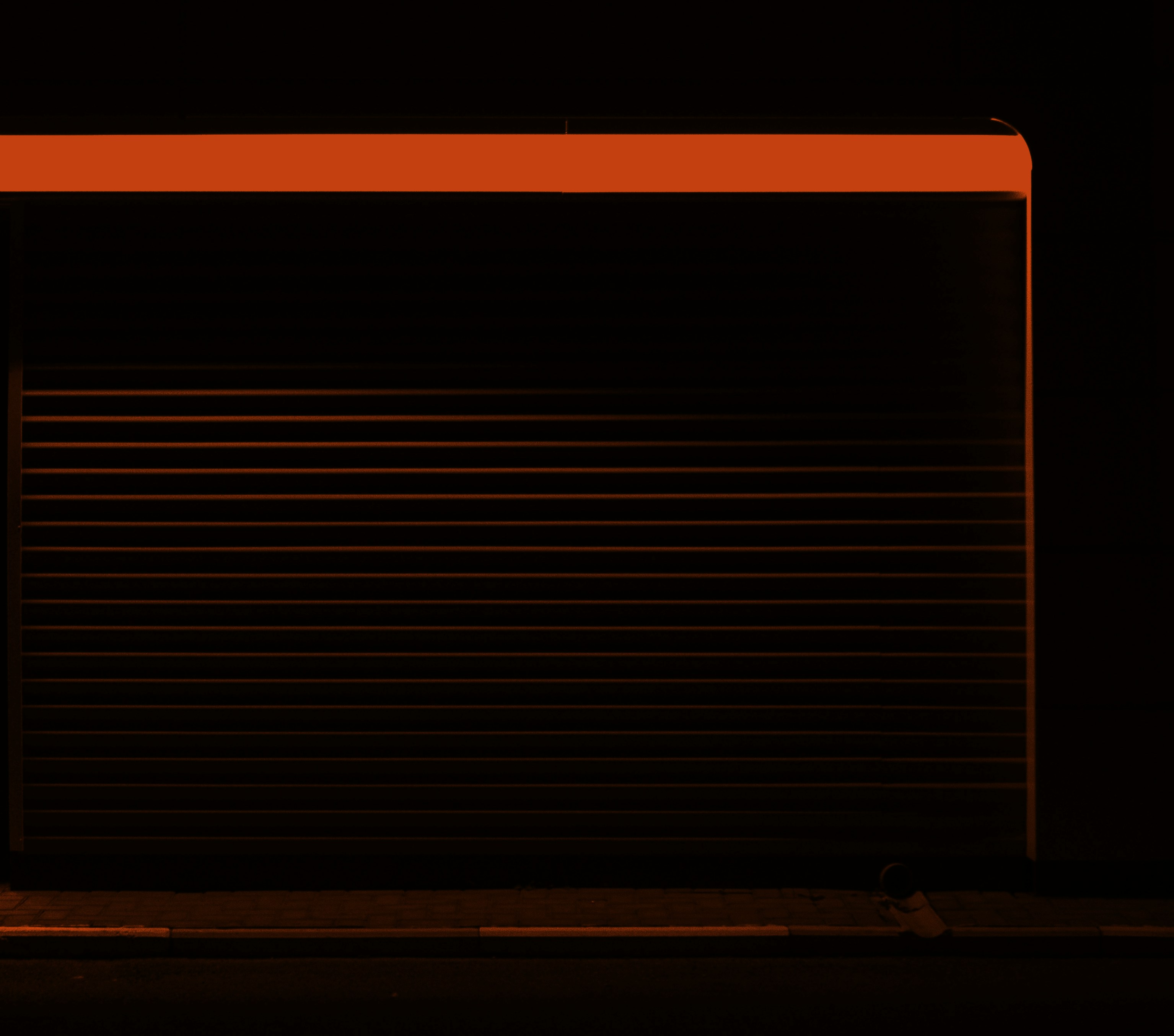 a red light is shining on a black background
