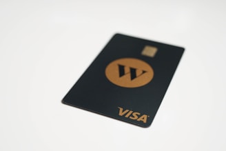 a visa card sitting on top of a white table