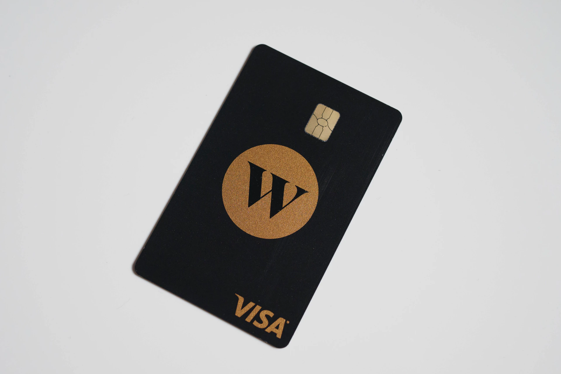 a visa card sitting on top of a white table