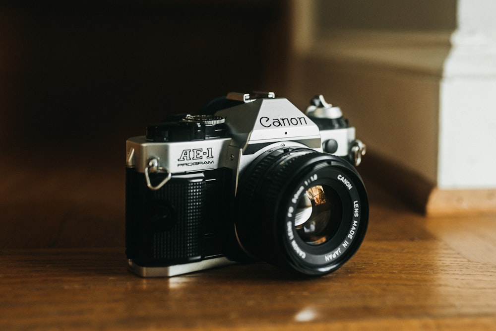 a camera sitting on top of a wooden table