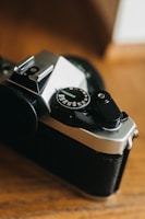 Close-up of a vintage film camera capturing a dramatic scene on set