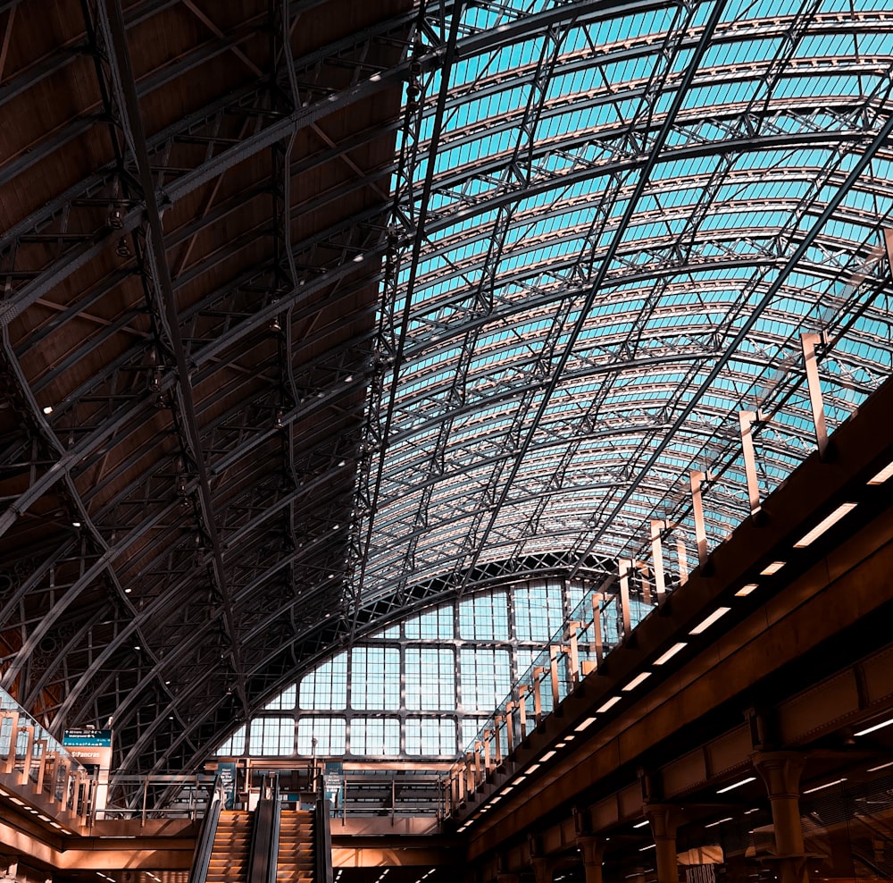 the inside of a train station with a skylight