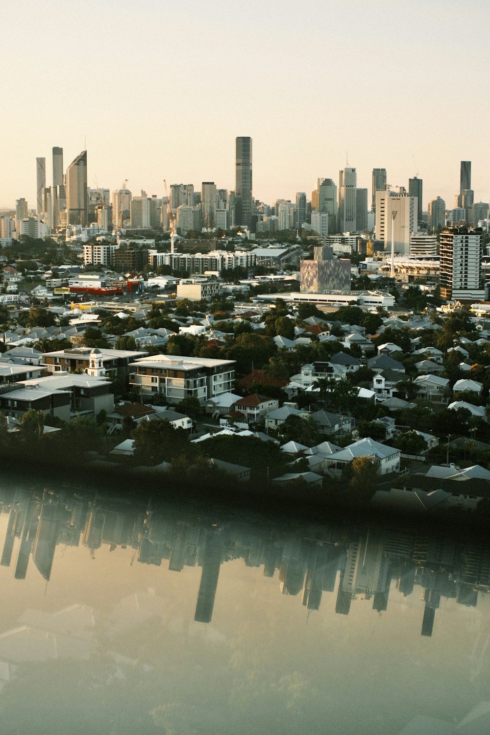 a view of a city with a body of water in front of it