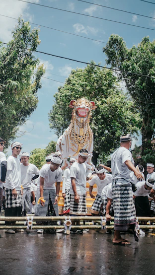 a group of people walking down a street next to a float