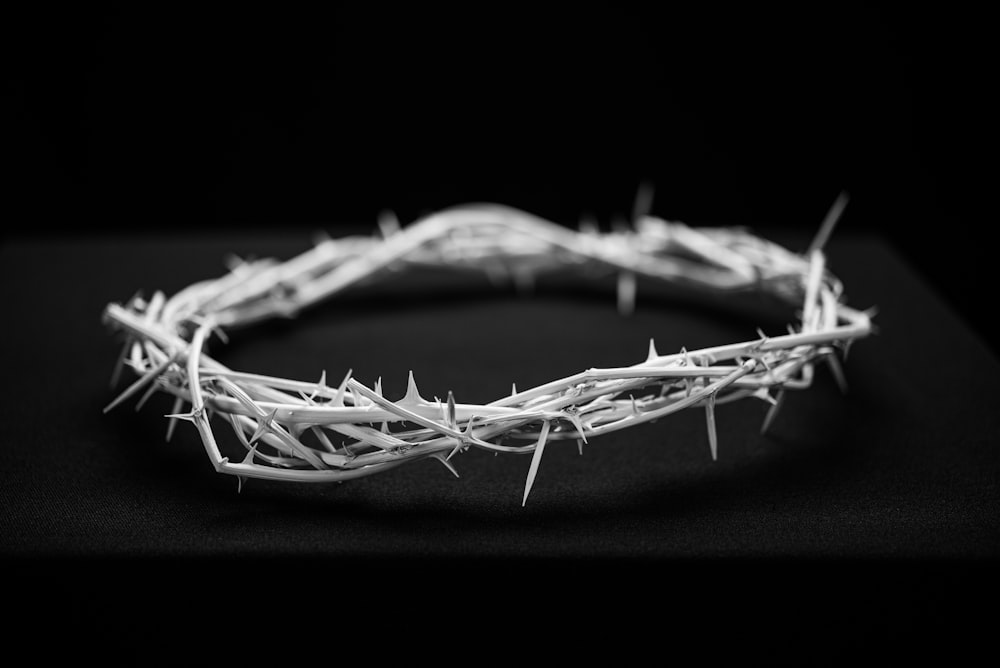 a crown of barbed wire on a black background