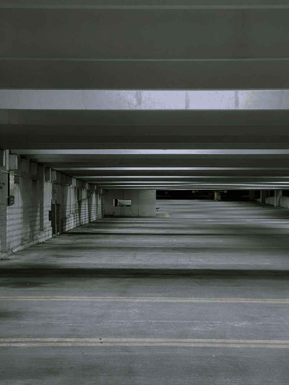 a parking garage filled with lots of empty parking spaces