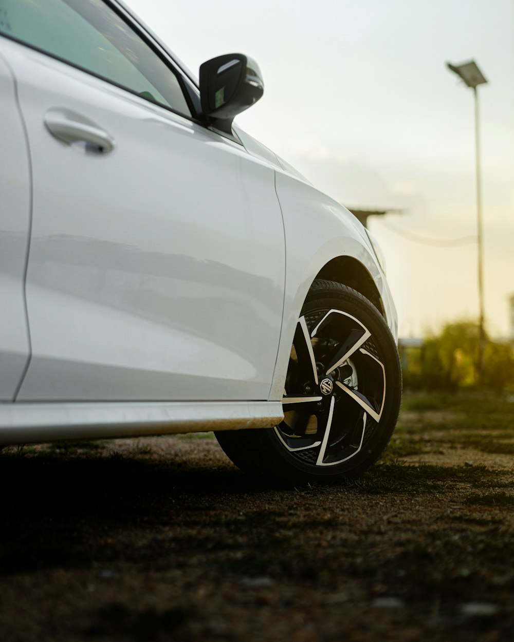 a white car parked in a parking lot