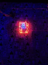 A cyberpunk-style holographic cat silhouette layered over a glowing neon-green network grid.