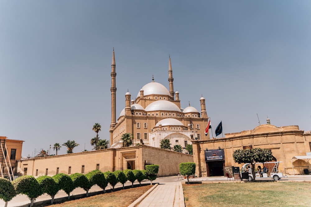 a large brown building with a white dome