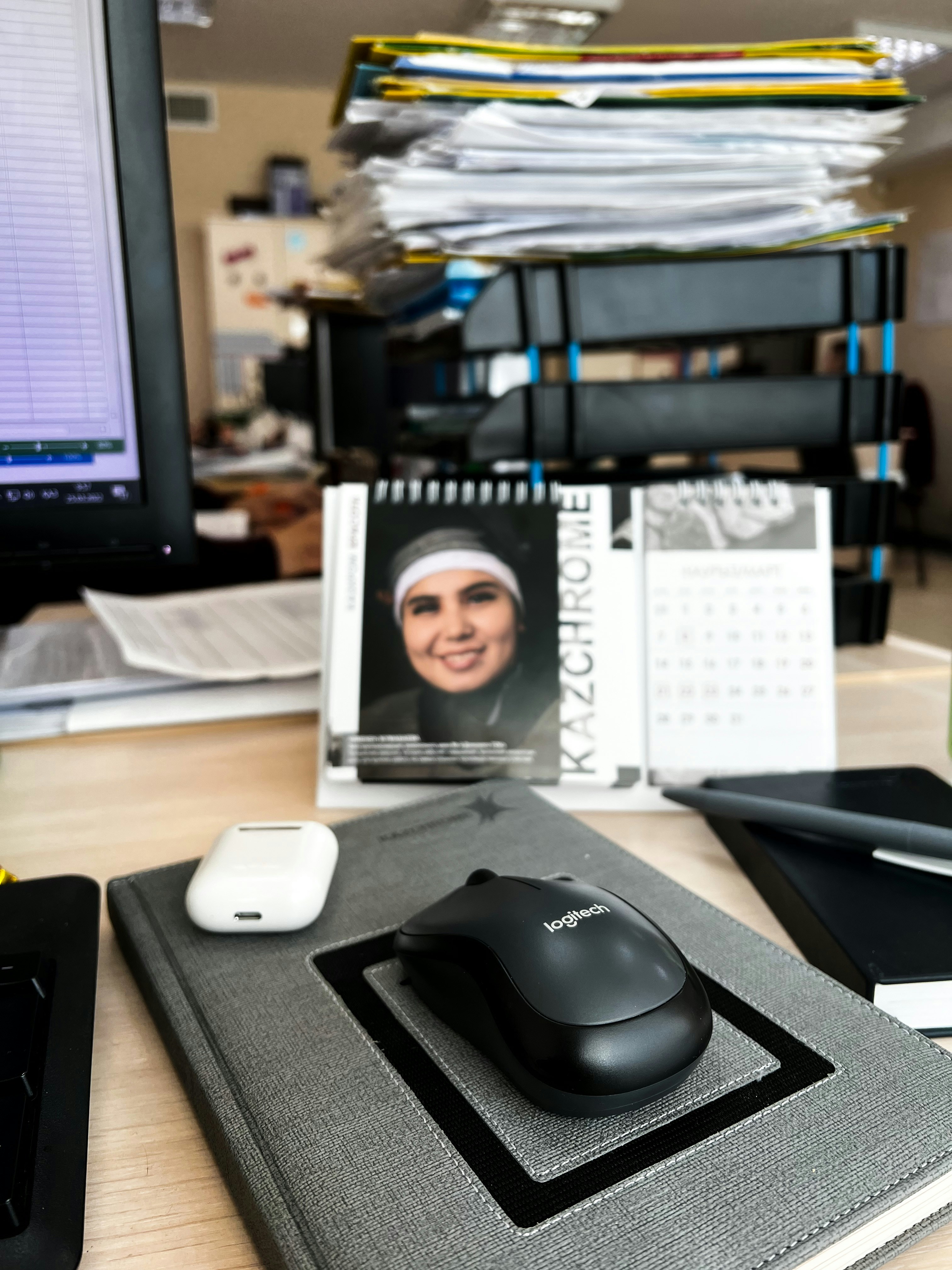 Calendar with marked compliance dates and regulatory documents spread on office desk