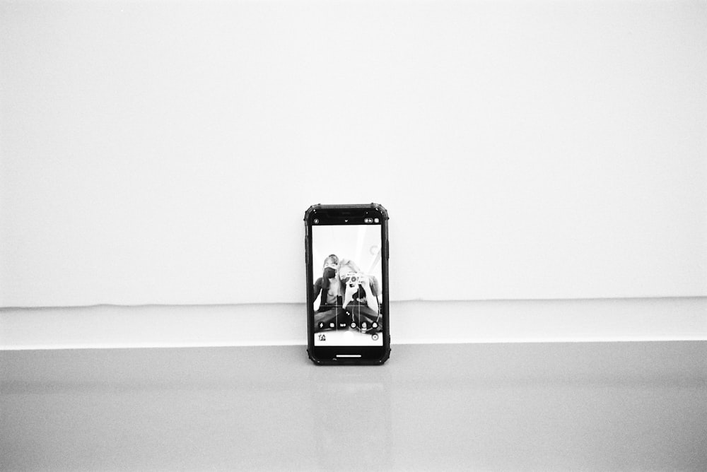 a black and white photo of a cell phone